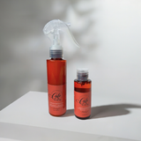 Café Hair Co. Length Retention Duo – Black woman-owned natural hair products including leave-in conditioner and sealing oil designed to prevent breakage and retain length on curly and coily hair studio view